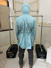 Load image into Gallery viewer, ss2004 Issey Miyake Light Blue Bungee Cord Long Raincoat - Size M