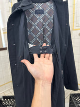 Load image into Gallery viewer, 2000s Burberry Prorsum Black Wool Trench Coat with Packable Hood and Waist Cinch - Size M