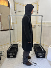Load image into Gallery viewer, 2000s Burberry Prorsum Black Wool Trench Coat with Packable Hood and Waist Cinch - Size M