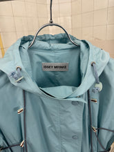 Load image into Gallery viewer, ss2004 Issey Miyake Light Blue Bungee Cord Long Raincoat - Size M