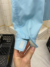 Load image into Gallery viewer, 2000s Samsonite 'Travel Wear' Baby Blue Nylon Work Jacket - Size L
