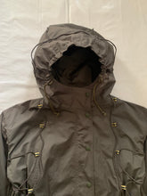 Load image into Gallery viewer, ss2004 Issey Miyake Military Khaki Bungee Cord Long Raincoat - Size M