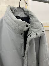 Load image into Gallery viewer, 2000s Samsonite 'Travel Wear' Glacier Blue Puffer Jacket - Size XL