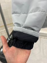 Load image into Gallery viewer, 2000s Samsonite 'Travel Wear' Glacier Blue Puffer Jacket - Size XL