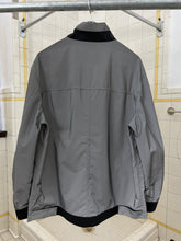 Load image into Gallery viewer, 2000s Samsonite 'Travel Wear' Reflective Glass Jacket - Size XL