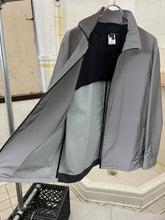Load image into Gallery viewer, 2000s Samsonite 'Travel Wear' Reflective Glass Jacket - Size XL
