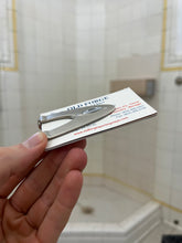 Load image into Gallery viewer, 2000s Oakley Silver Pendant Insignia Money Clip - Size OS