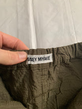 Load image into Gallery viewer, ss2000 Issey Miyake Dark Khaki Textured Nylon Bunge Hem Skirt - Size M