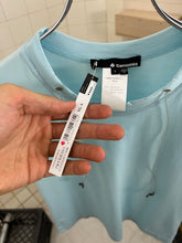 Load image into Gallery viewer, 2000s Samsonite ‘Travel Wear’ Tee with Built in Glasses Cords - Size XS